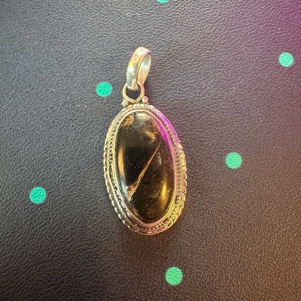 Black stone (quartz?) with gold sterling silver pendant